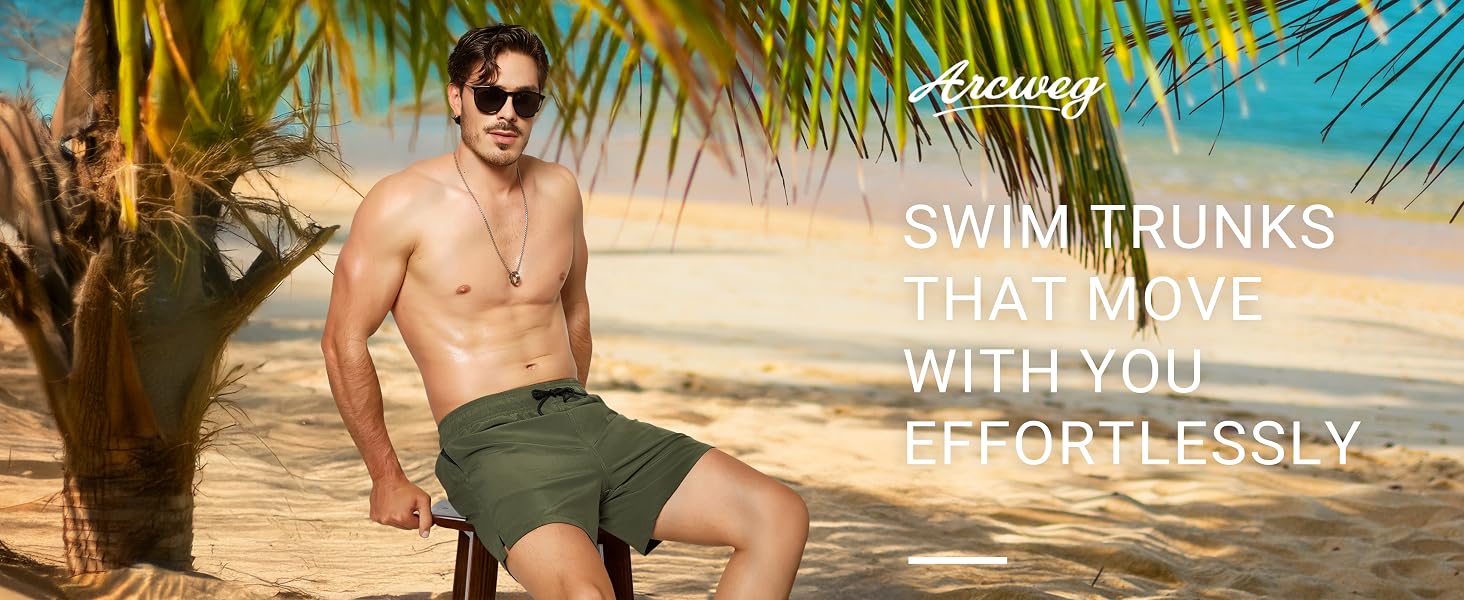 Green swim trunks worn by person on beach. Palm fronds frame top of image. Text advertises 'Swim trunks that move with you effortlessly'.