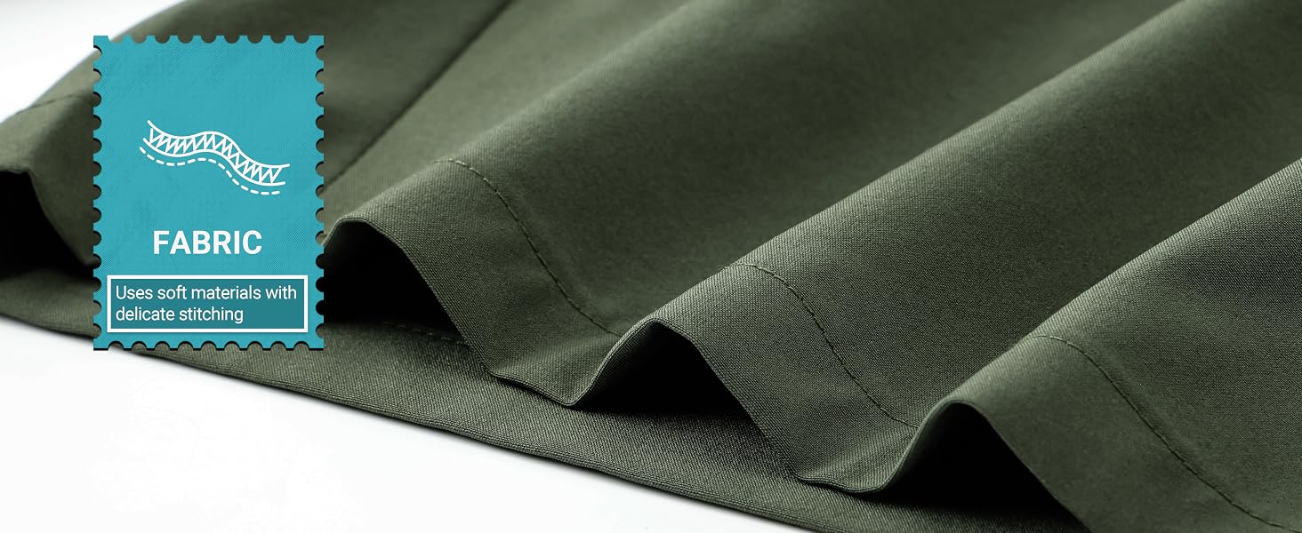 Dark green fabric draped in folds, showcasing its texture and drape. A teal label in the corner reads 'FABRIC' with a wavy line pattern above it.