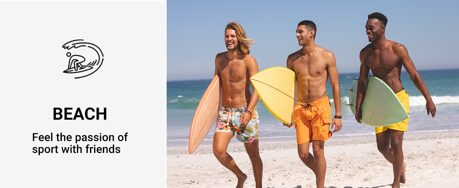 Three shirtless men walking on a beach, each carrying a surfboard. They're wearing colorful swim shorts and the ocean is visible in the background.